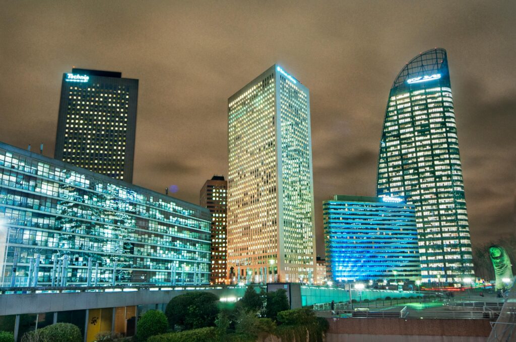 pexels photo 9737679 9737679 Night view of illuminated skyscrapers in La Défense, Paris. Urban skyline with architectural marvels glowing against the night sky.